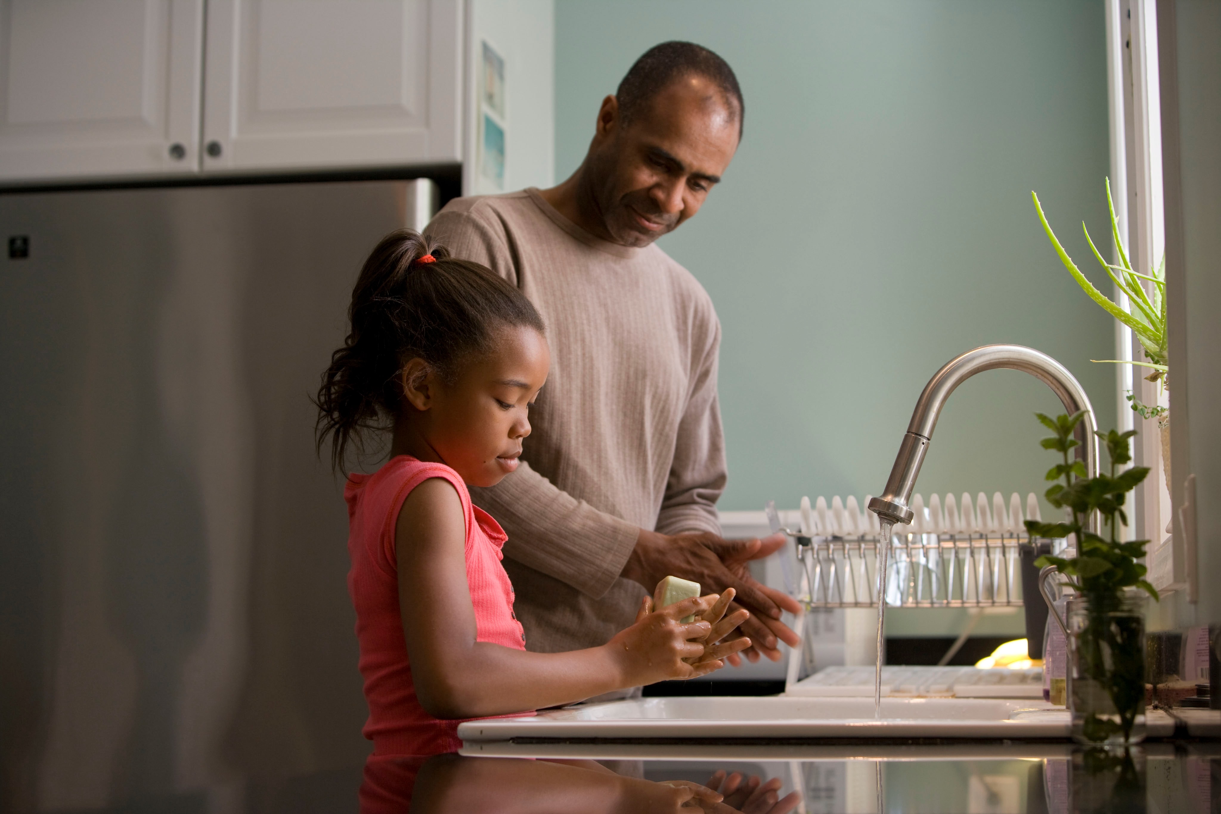 Dad and Daughter Doing Dishes