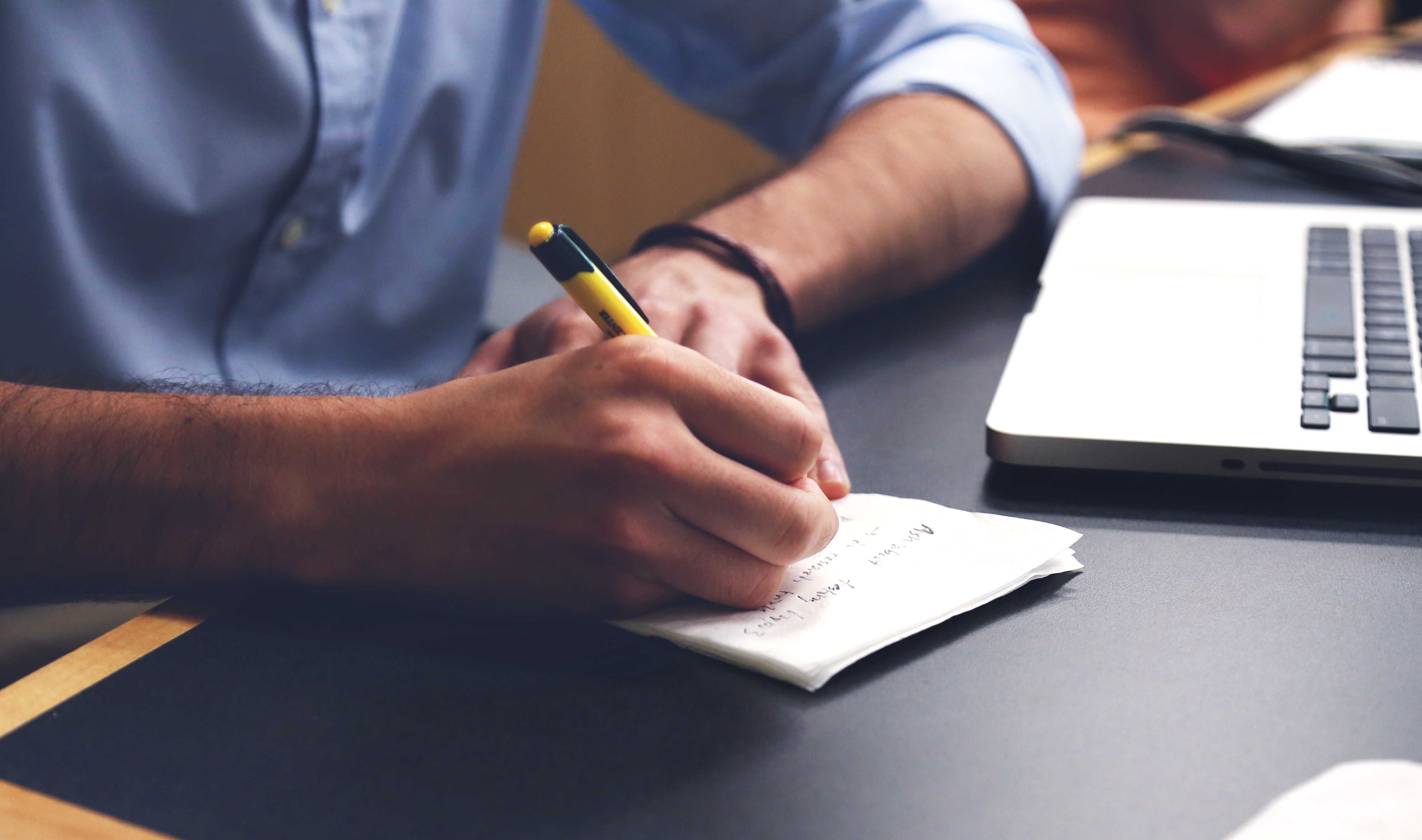 man taking notes