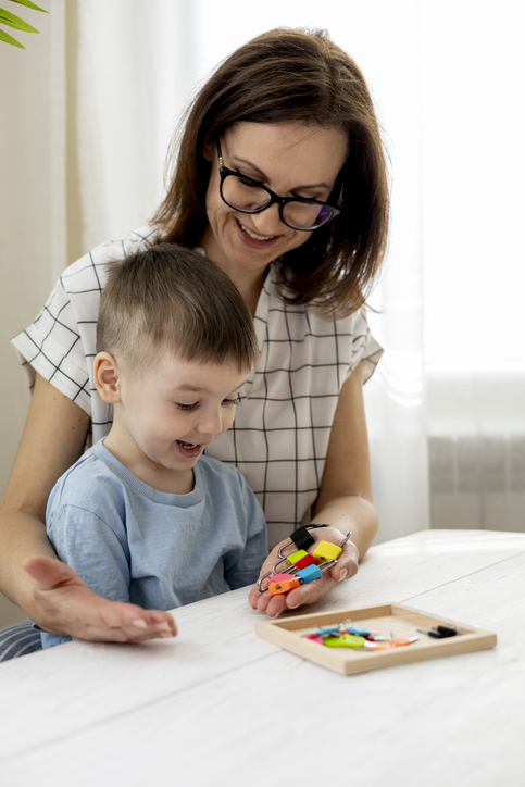Behaviour analyst at work with a young learner